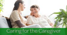 Caring for the caregiver. Caregiver and patient smiling while sitting on the sofa.